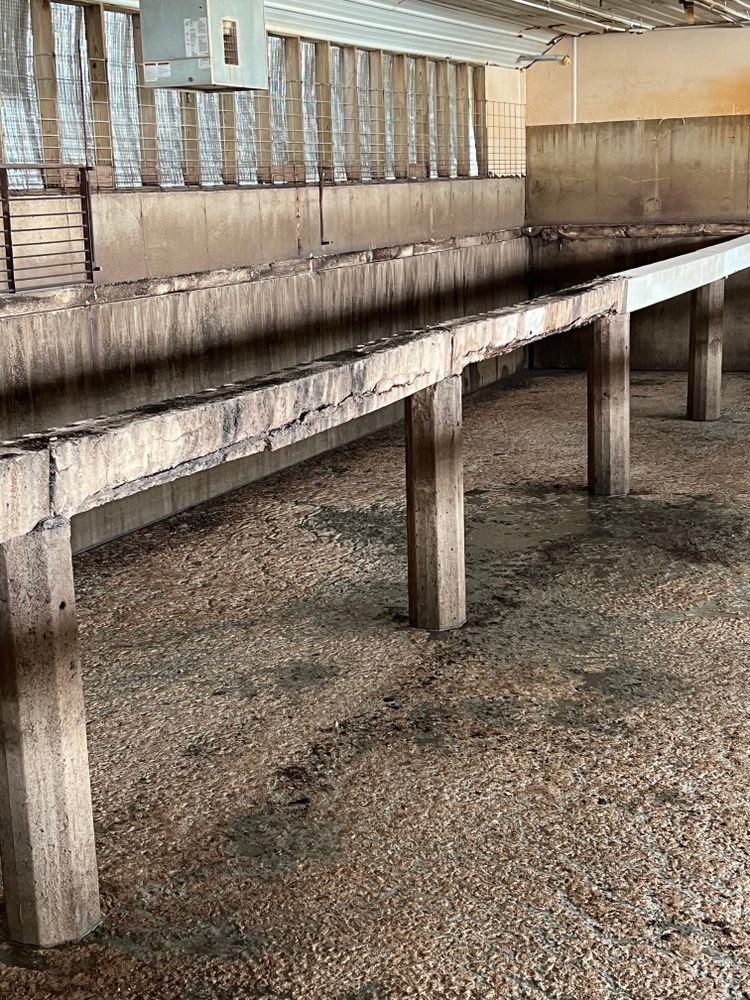 There is a long wooden bench in the middle of the room.