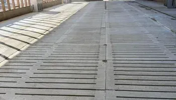 A concrete road with a lot of lines on it.