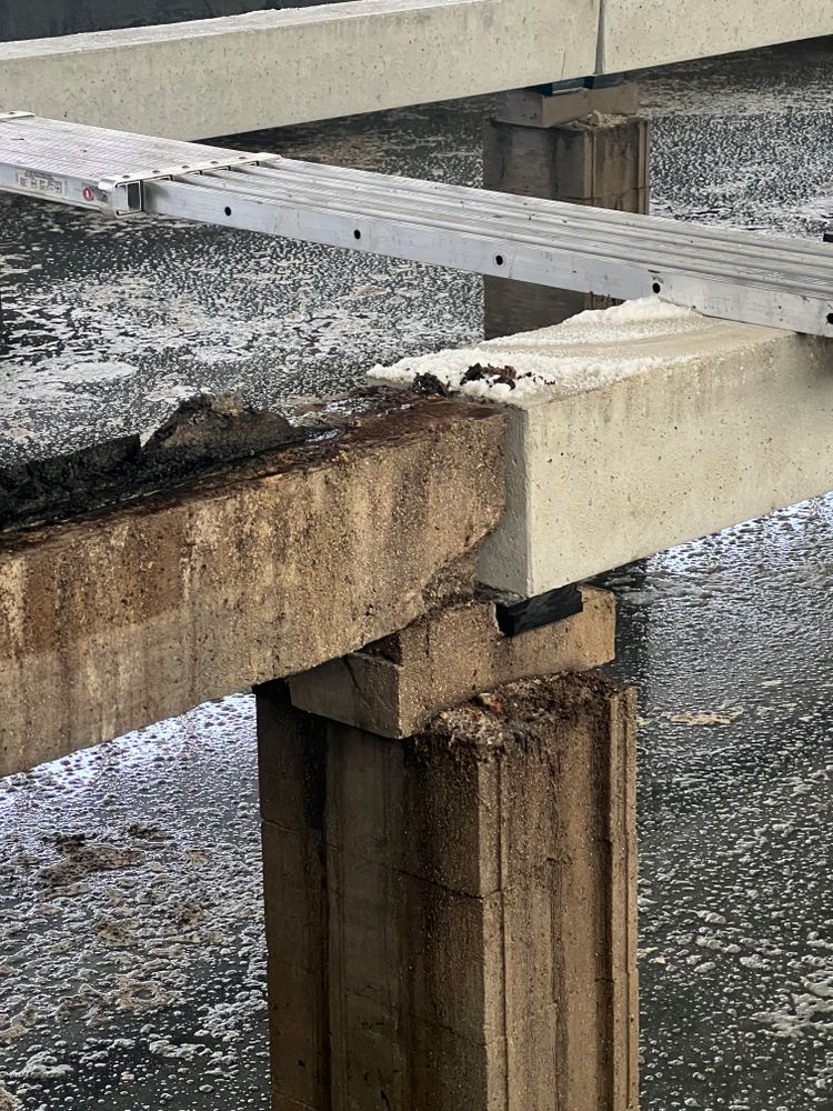 A close up of a bridge over a body of water