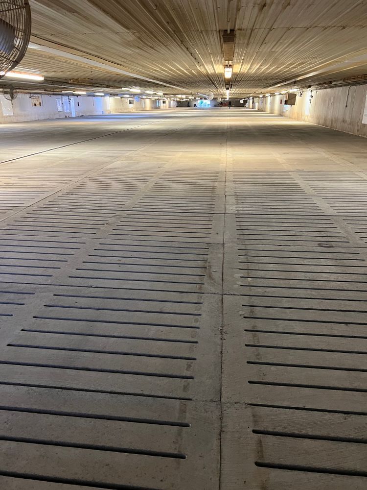 An empty parking garage with a mirror on the ceiling