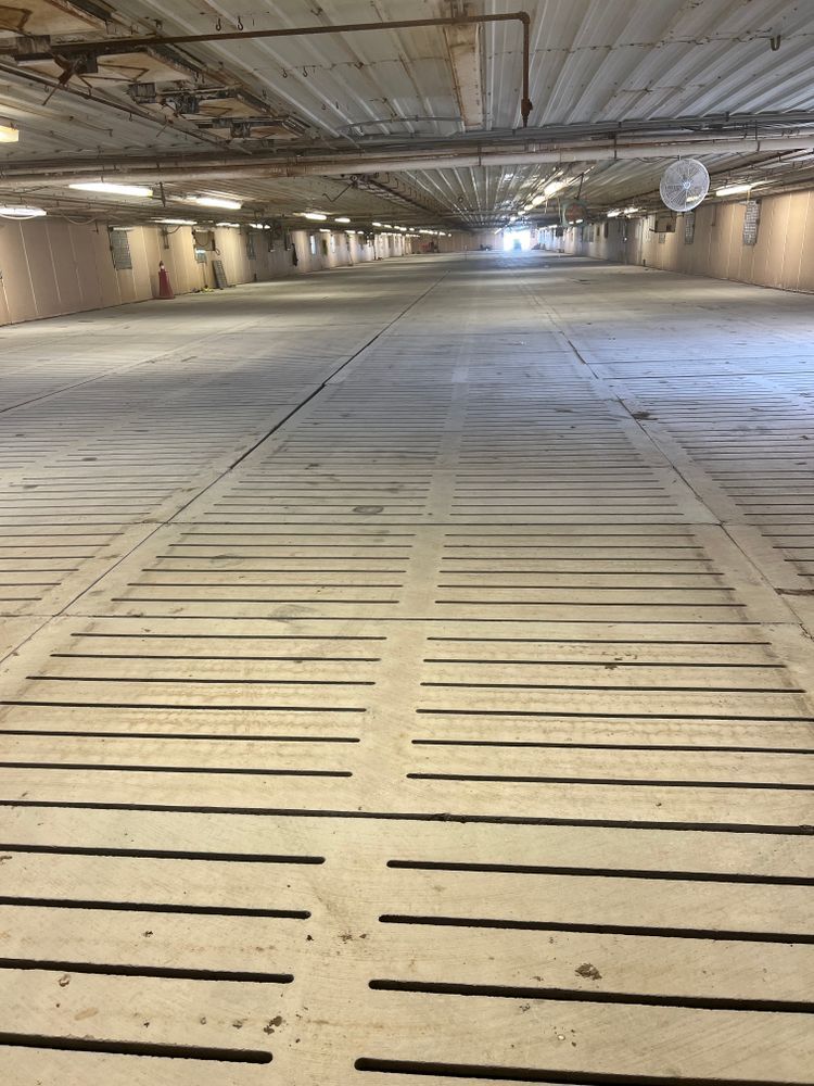 An empty parking garage with a lot of lines on the floor