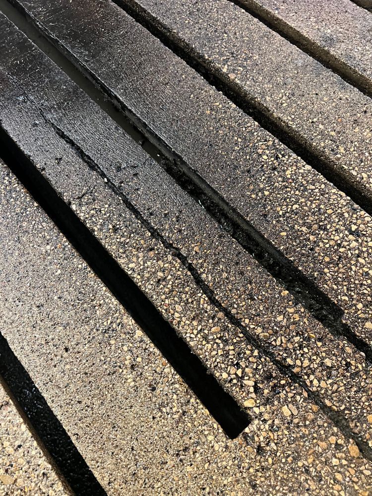 A close up of a concrete floor with a hole in the middle.