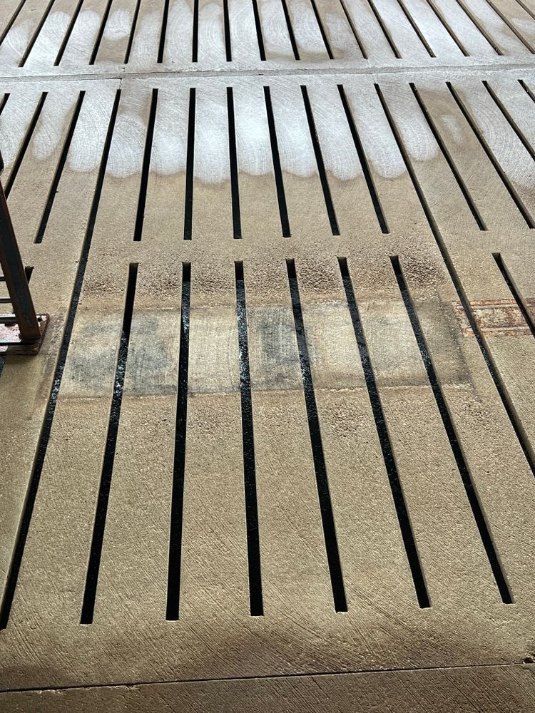 A close up of a fire escape with a staircase in the background.