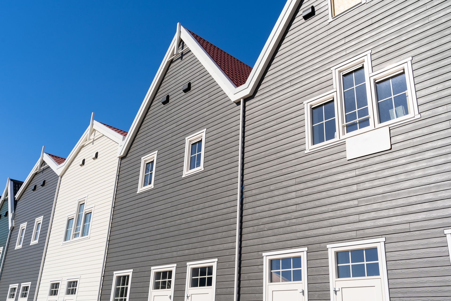A row of buildings with a blue sky in the background