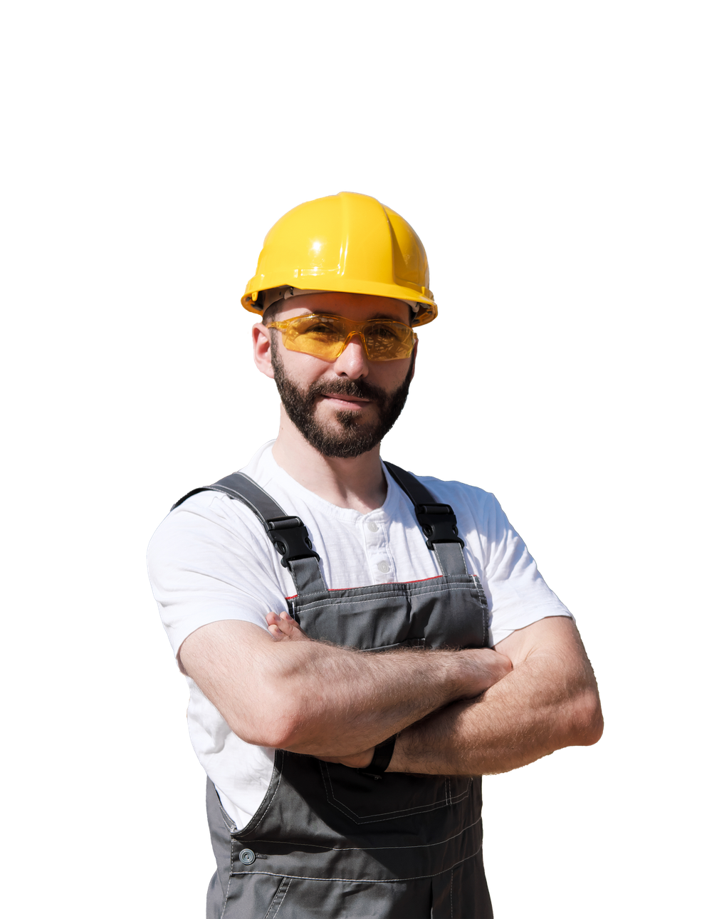 A man wearing a hard hat and safety glasses is standing with his arms crossed.