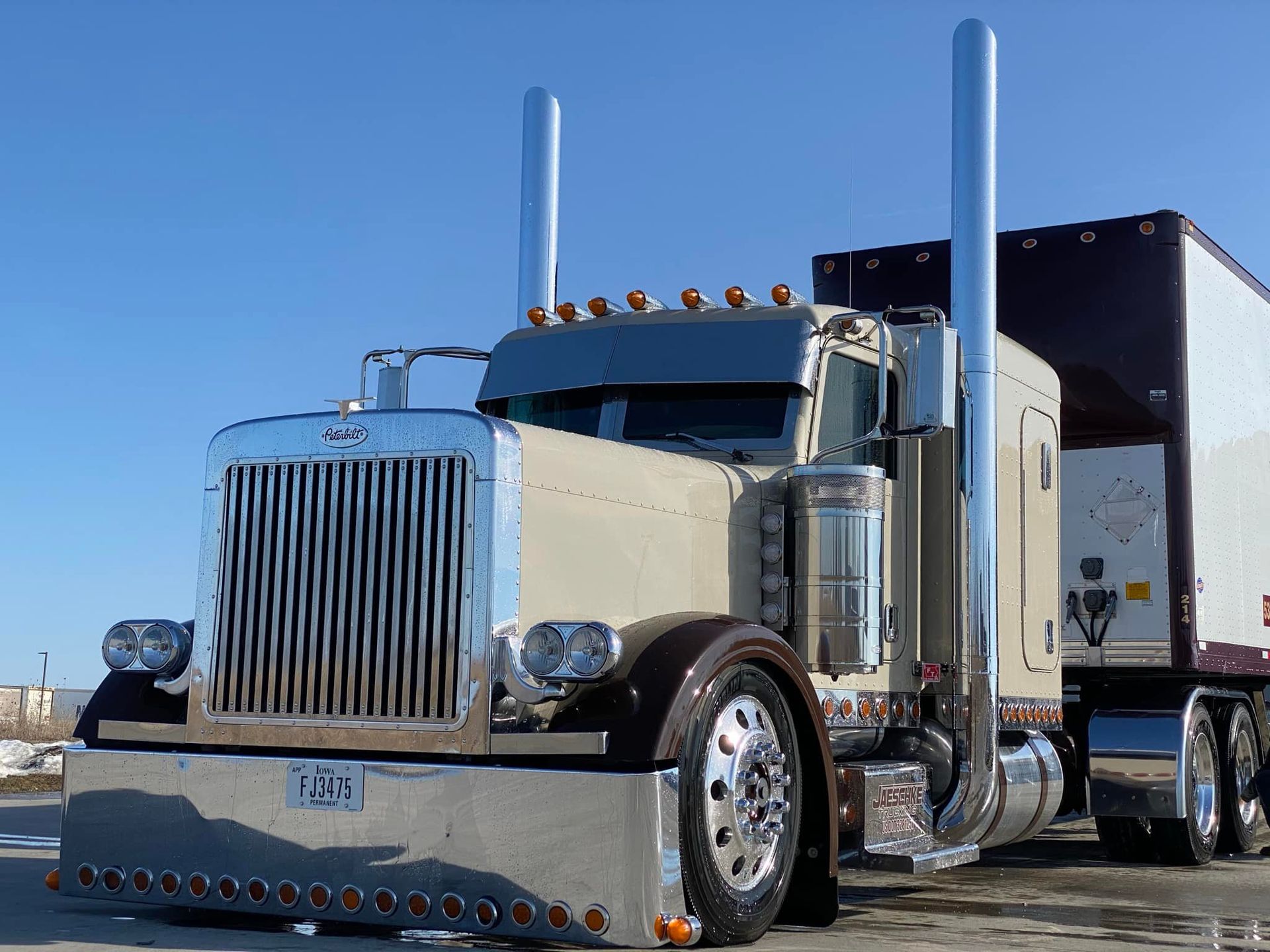 A semi truck with a license plate that says v70