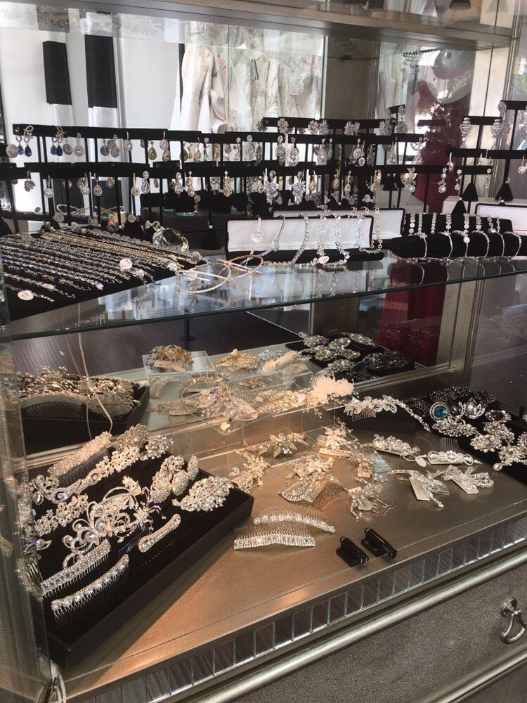 Jewelry display case with silver and gemstone necklaces and bracelets in a store