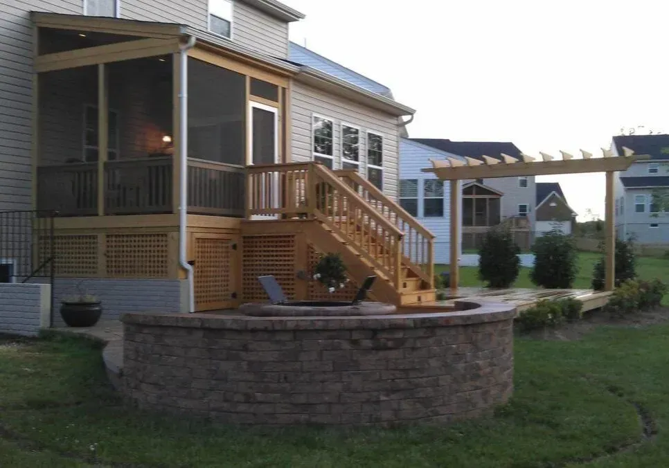 A house with a screened in porch and stairs