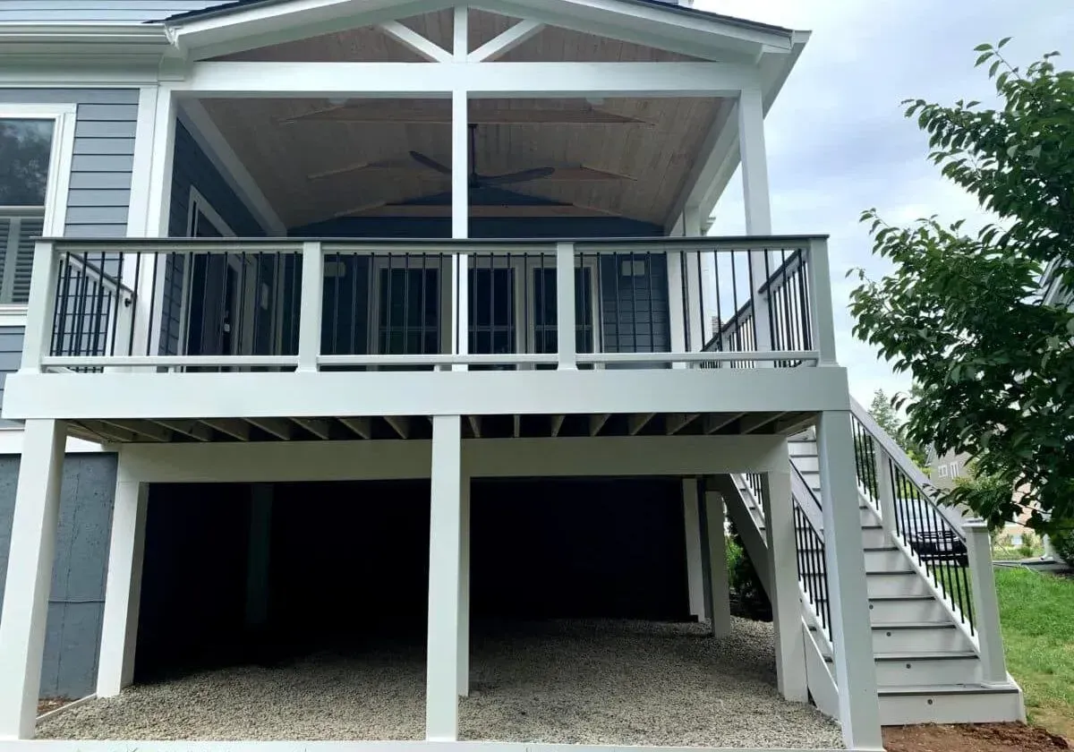 A house with a large deck and stairs leading up to it