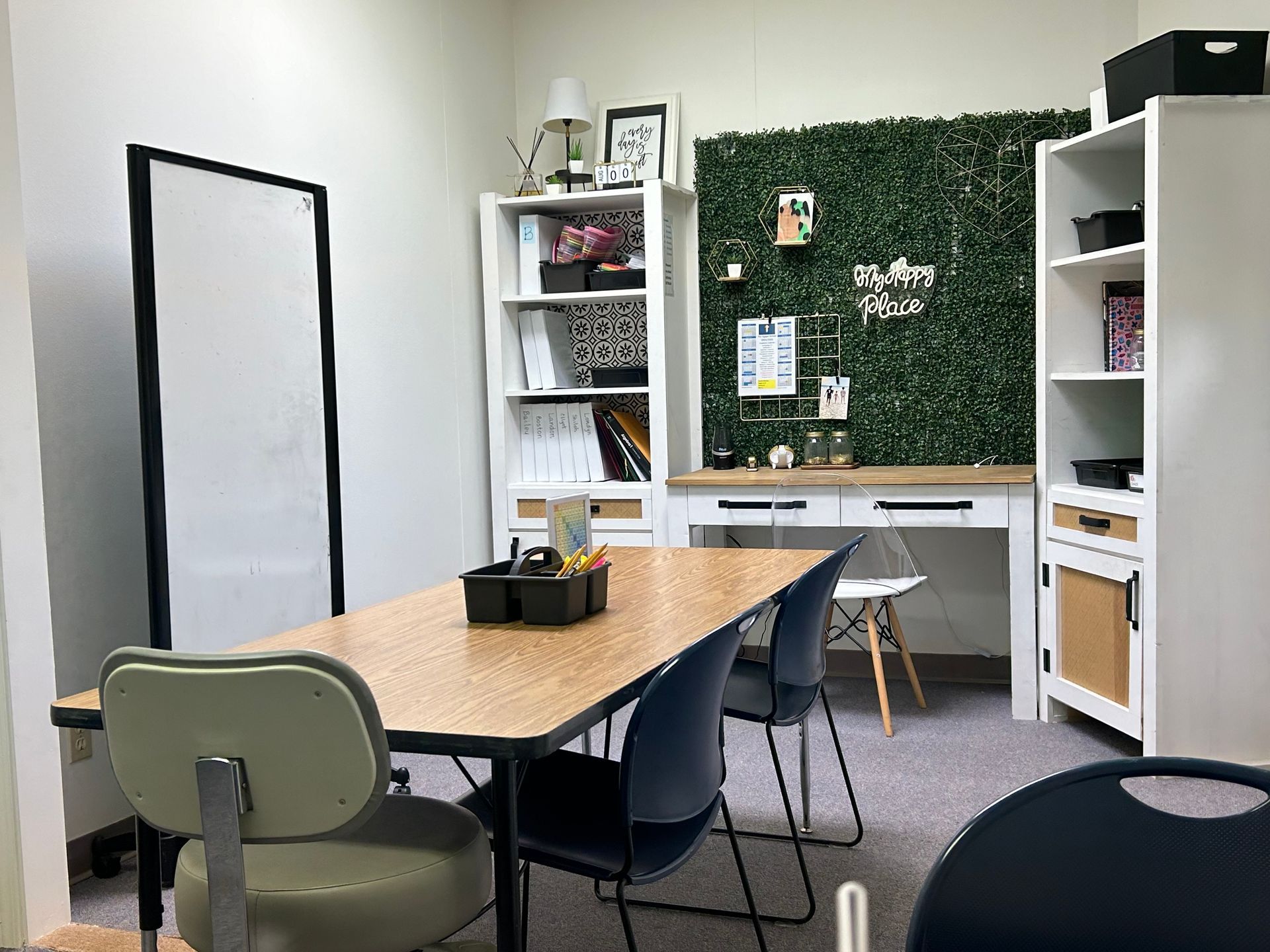 There is a table and chairs in the room.