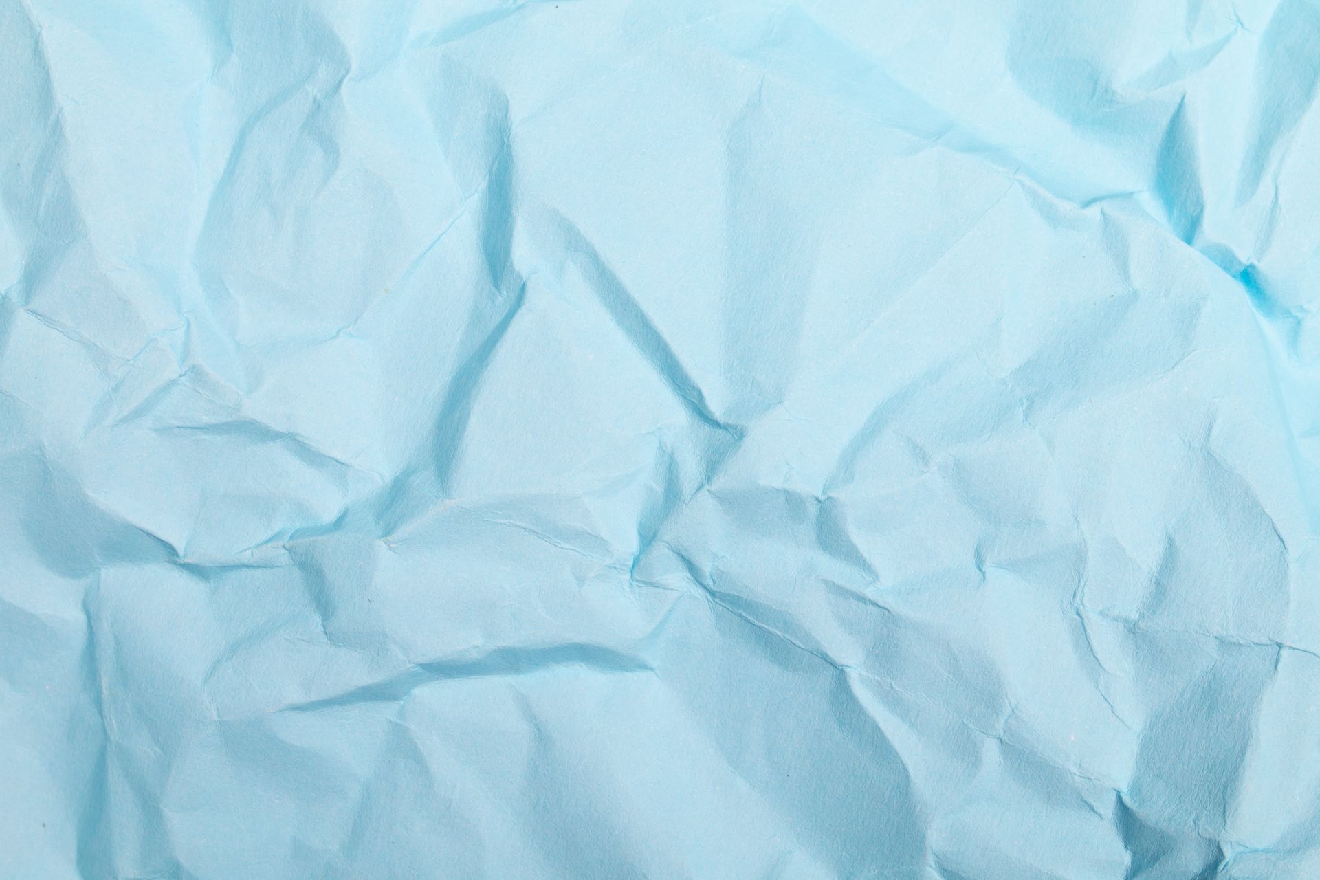 A close up of a piece of blue crumpled paper.