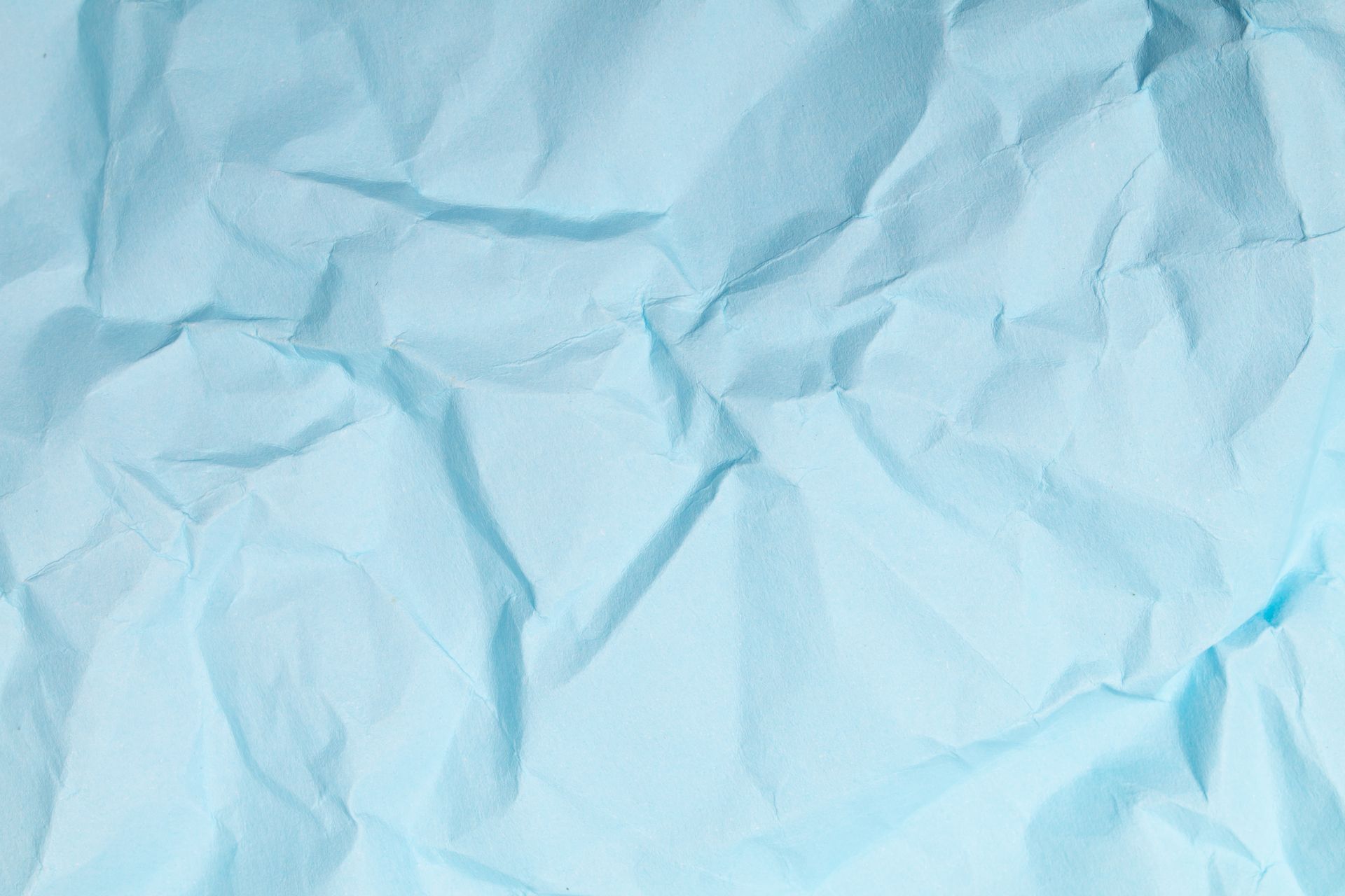 A close up of a piece of blue crumpled paper.