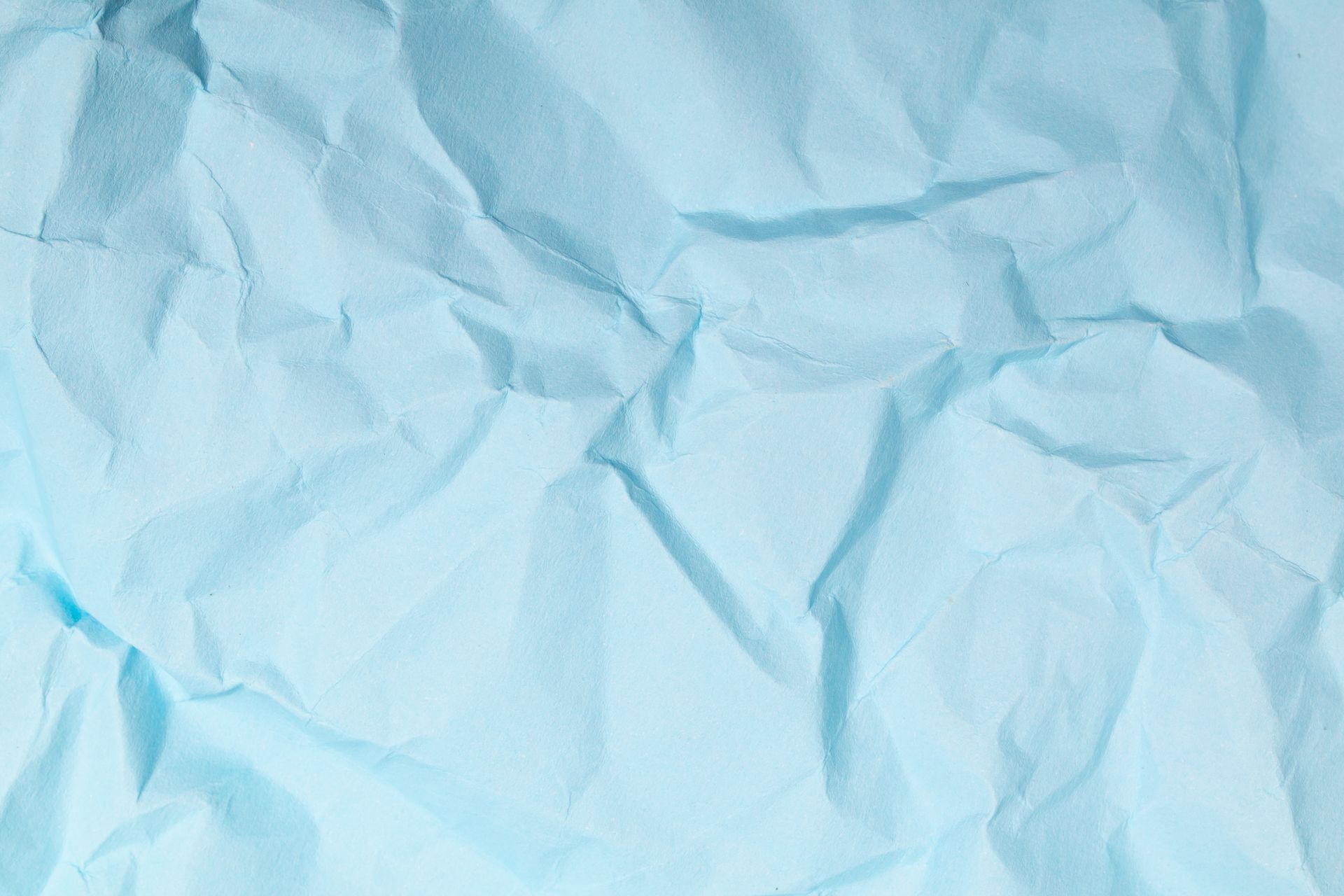 A close up of a piece of blue crumpled paper.