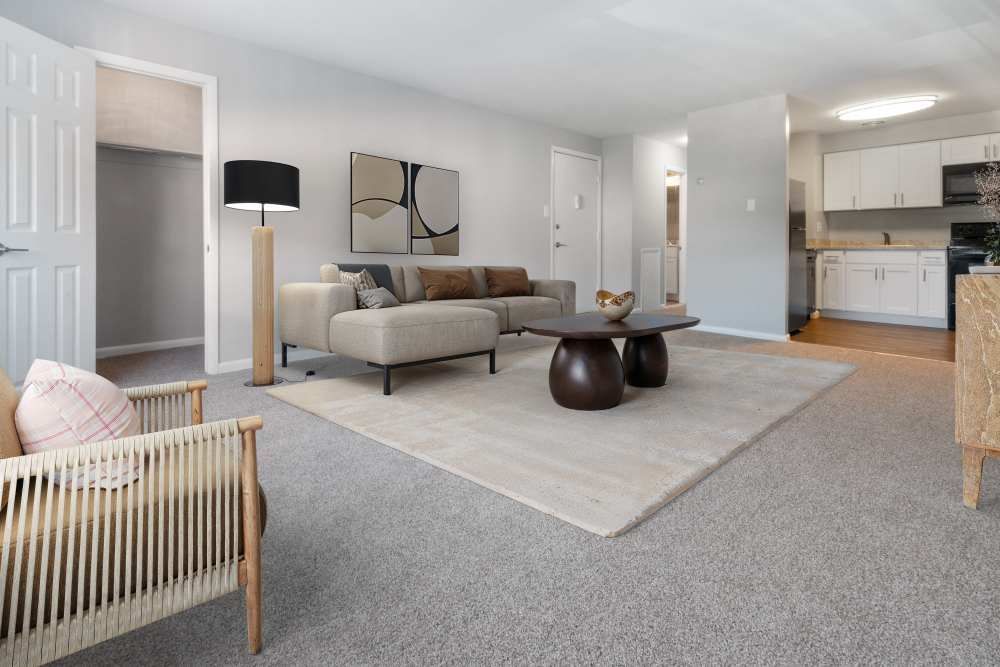 Living room with sofa, lamp, and dining area