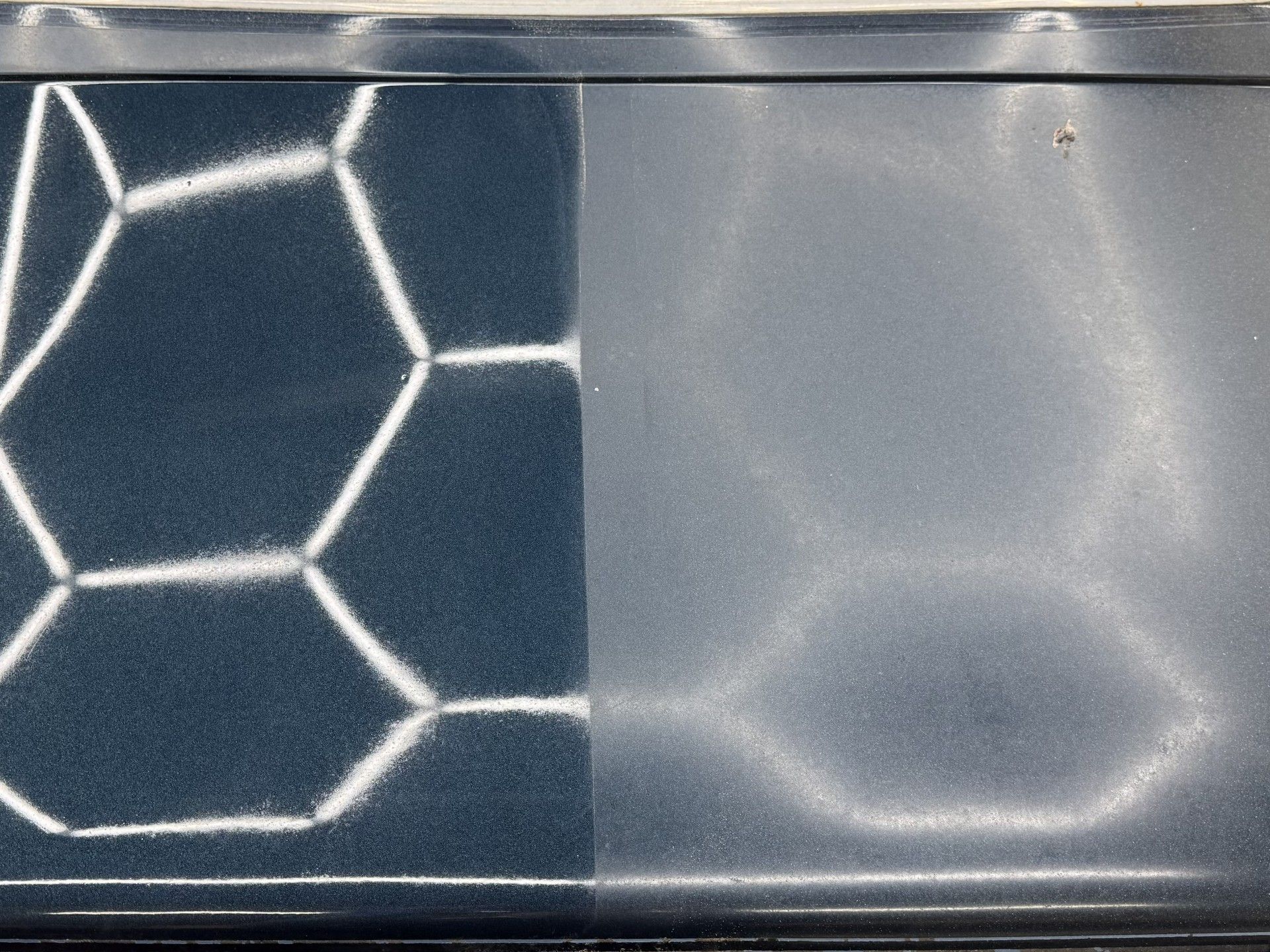 Corvette hood before and after paint correction.