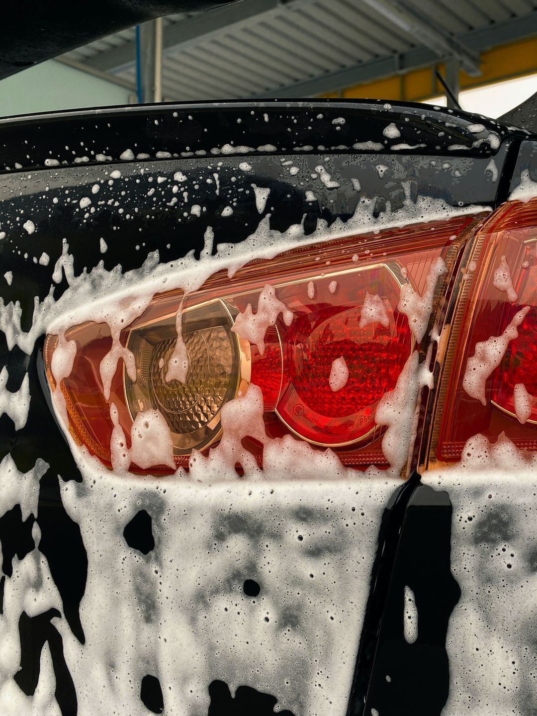 The back of a car is covered in foam.