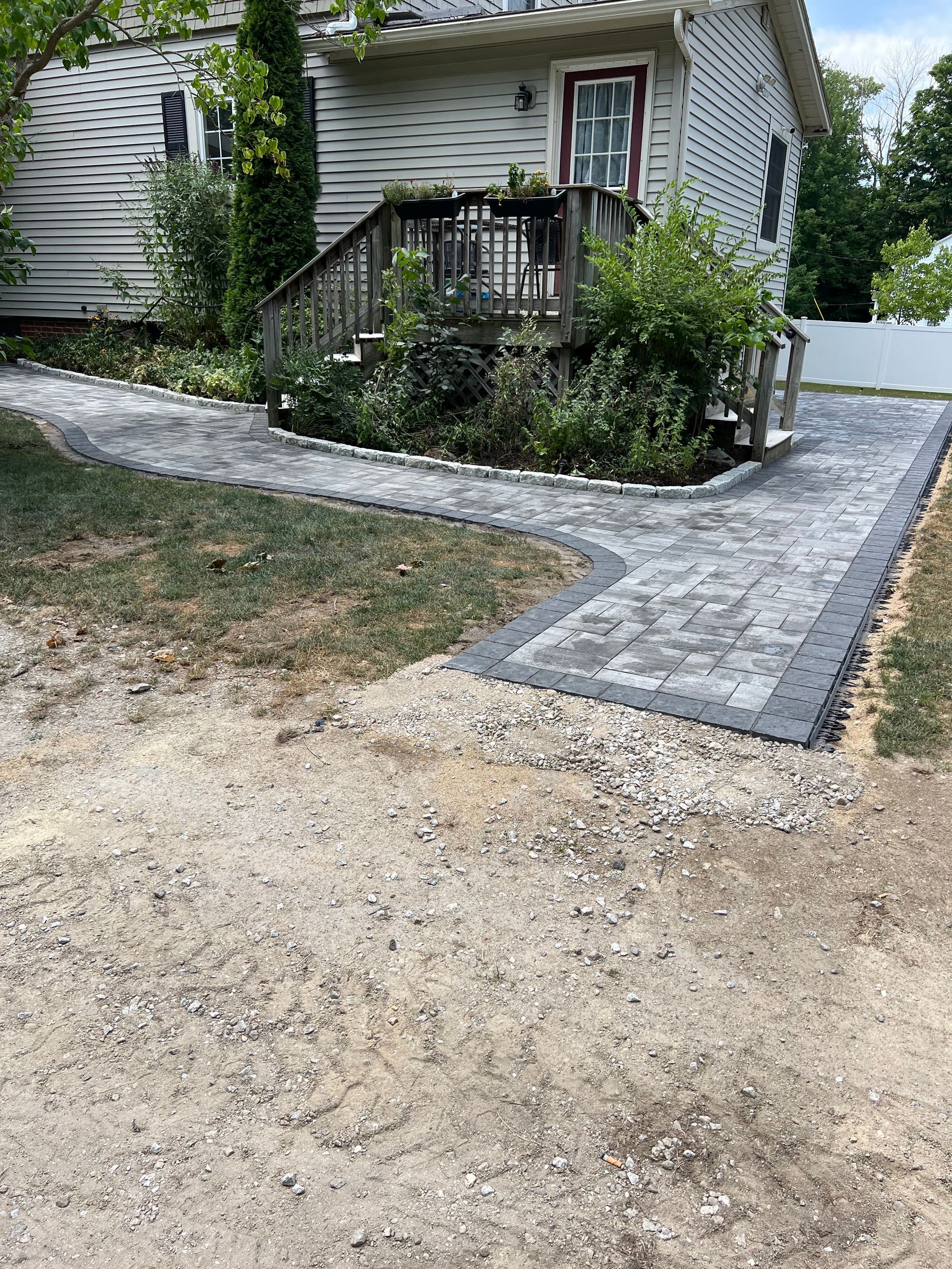 A walkway is being built in front of a house.