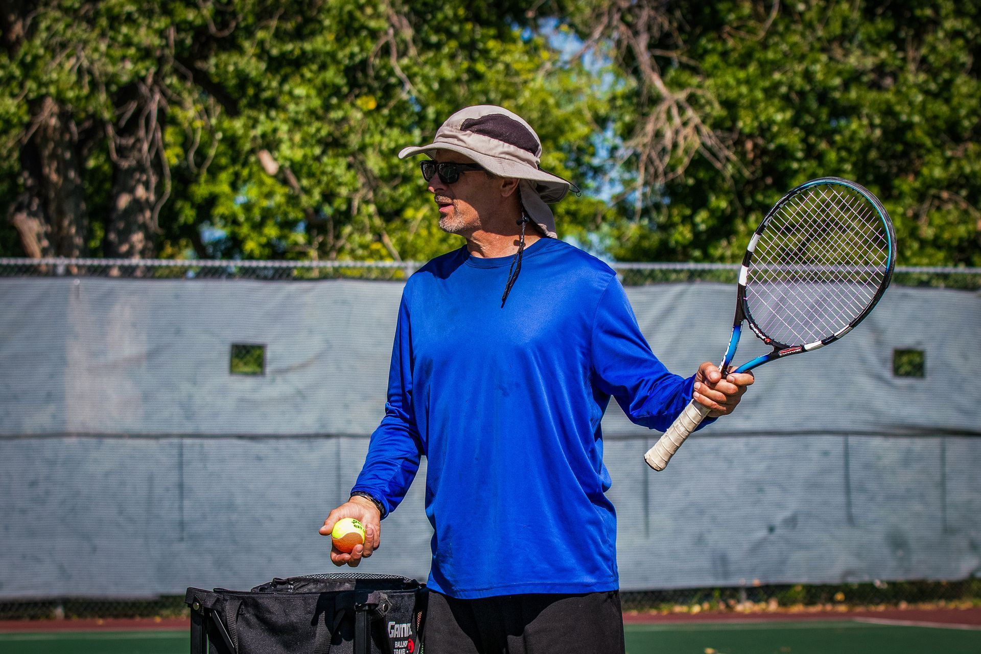 Tennis instructor giving directions to the class.