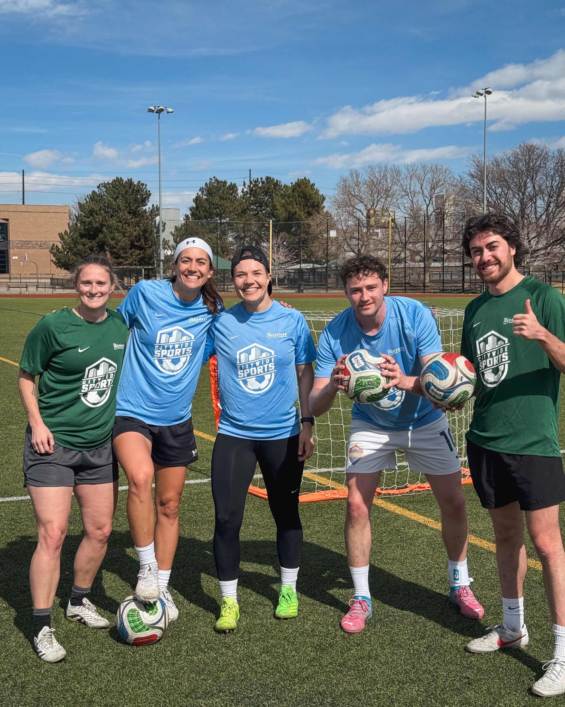 Co-Ed soccer team poses for a photo during a break in the game.