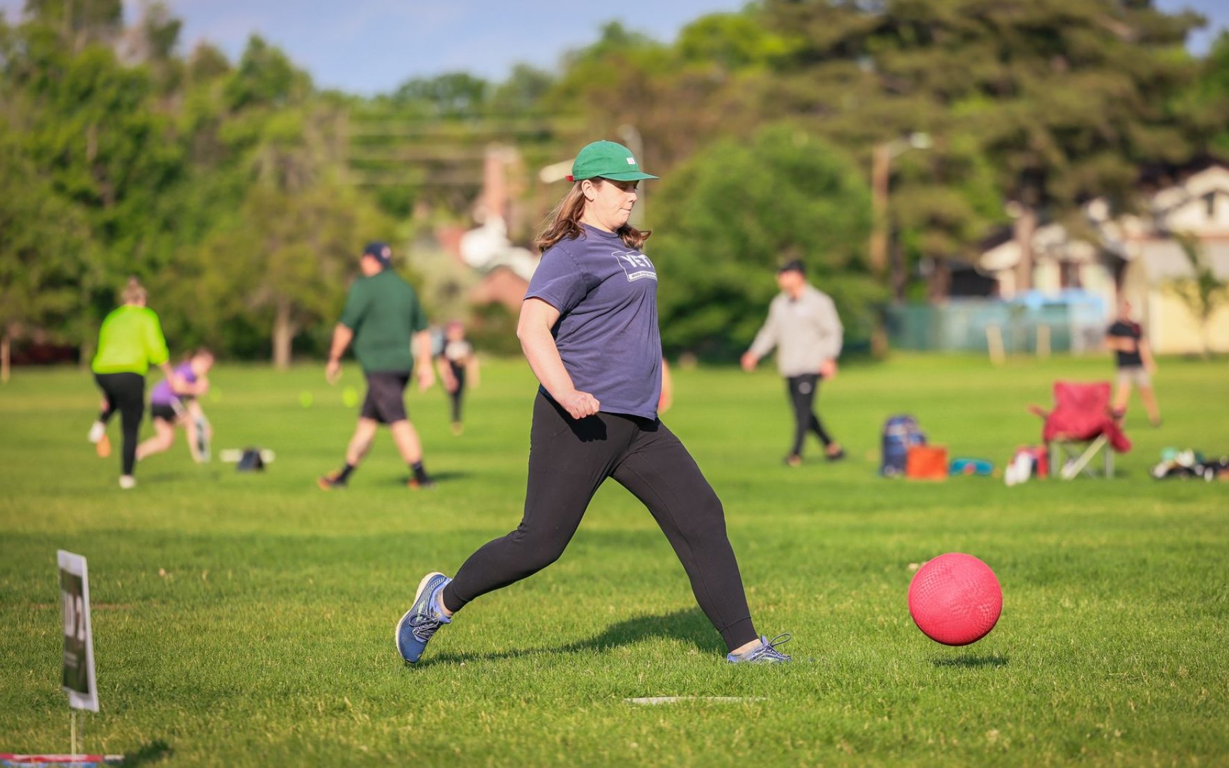 Male kickball player kicking the ball far.