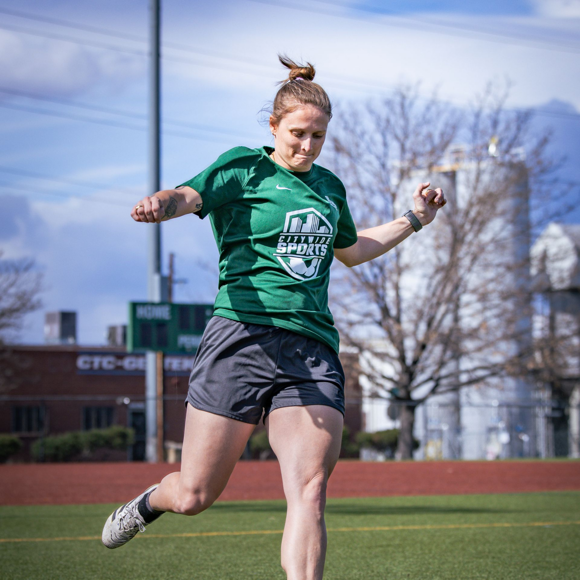 Soccer player dribbles the ball during a game.