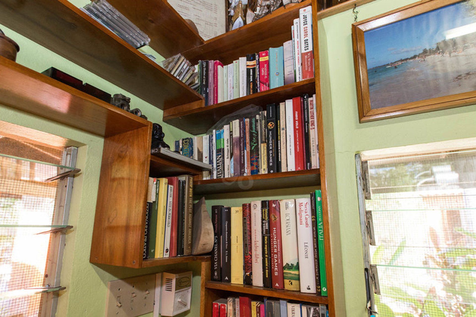 A bookshelf with a lot of books on it