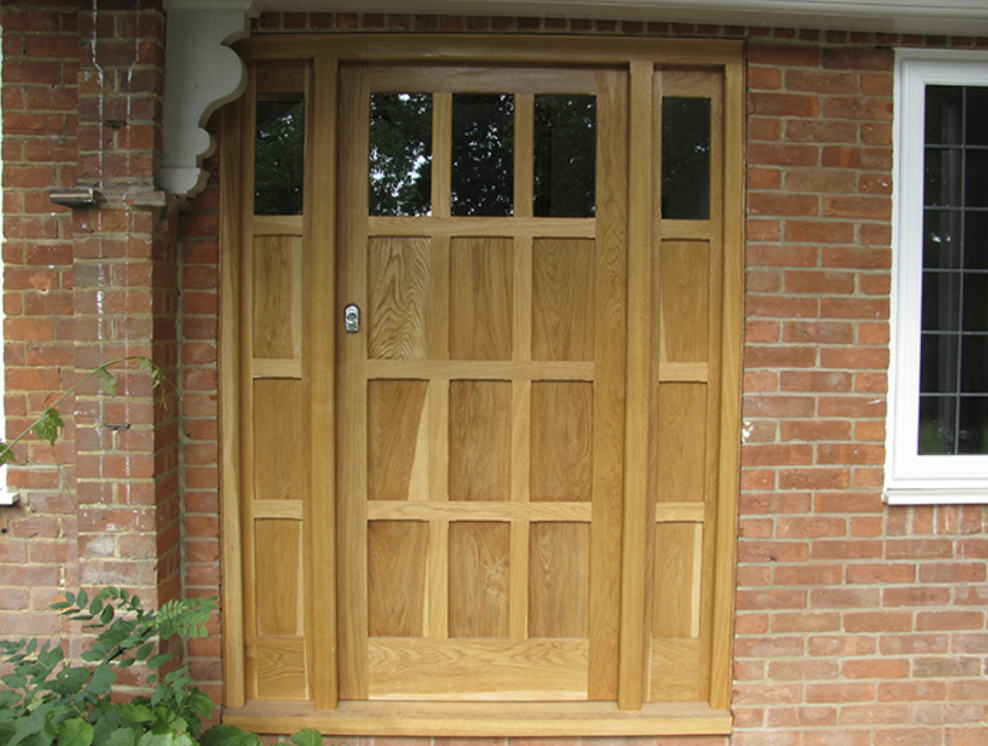 A brick building with a wooden door and a window