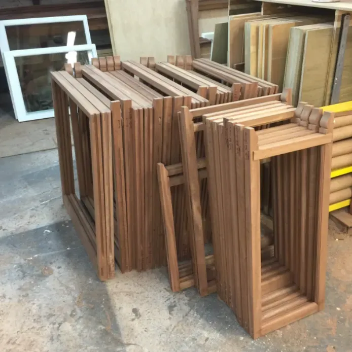 A bunch of wooden frames are stacked on top of each other