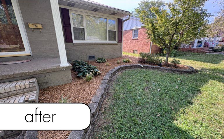Rocky path through a grassy area, surrounded by trees.