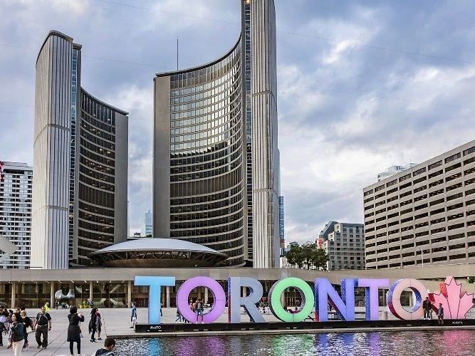 A sign that says toronto in front of a building