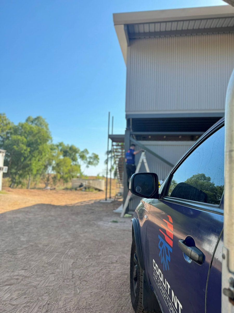 A Purple Car Is Parked In Front Of A Building — COOLIT NT In Katherine, NT