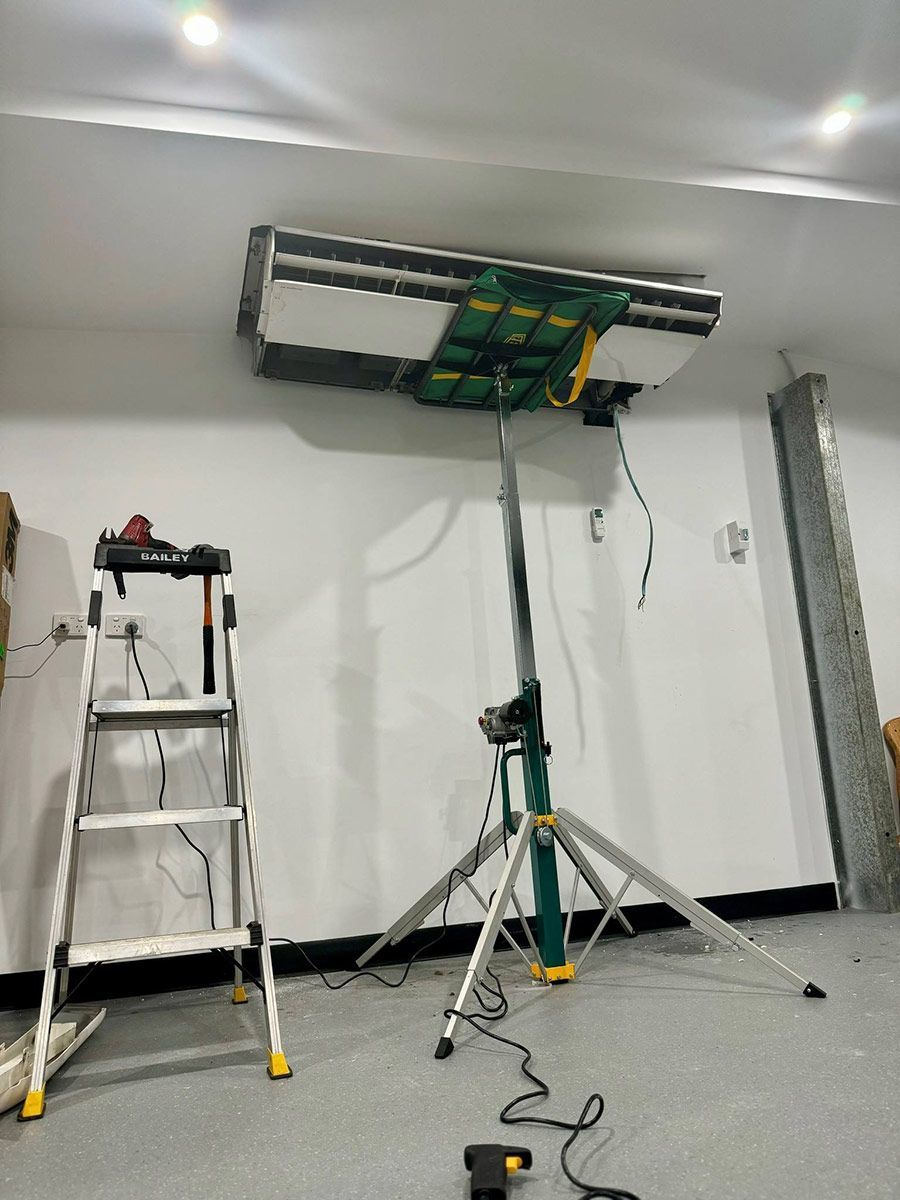 A Room With A Ladder And A Fan Hanging From The Ceiling — COOLIT NT In Noonamah, NT