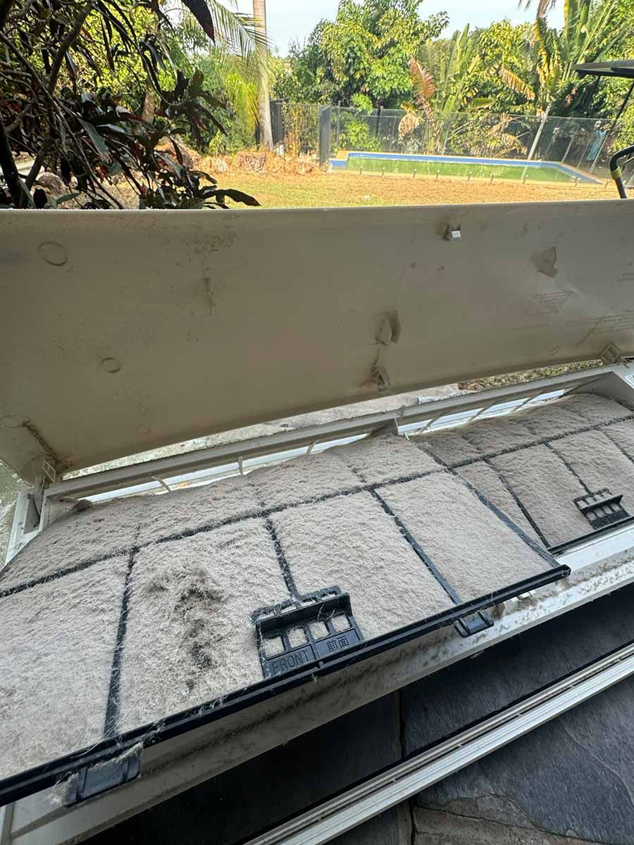 A Dirty Air Conditioner Filters Are Sitting On The Ground Next To A Pool — COOLIT NT In Howard Springs, NT
