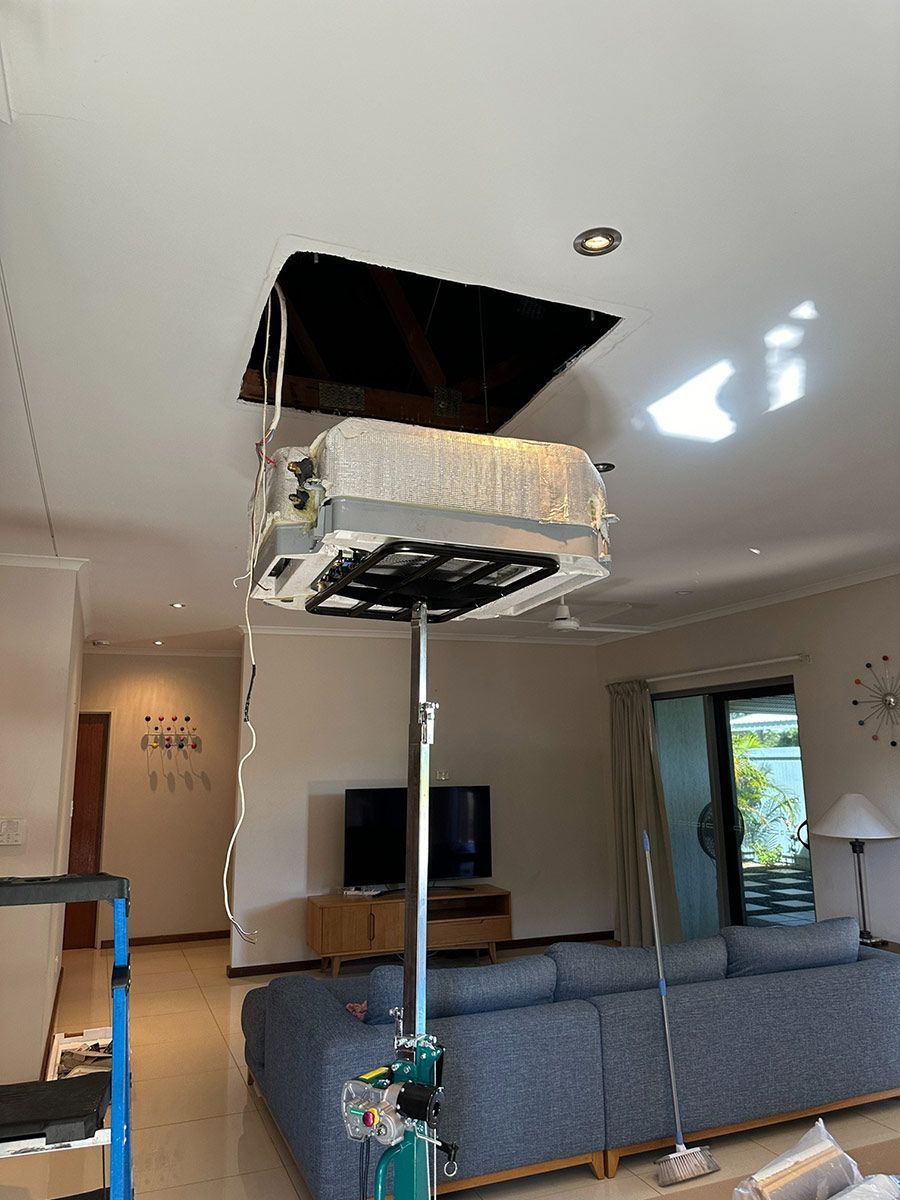 A Living Room With A Central AC Outlet Hanging From The Ceiling — COOLIT NT In Howard Springs, NT