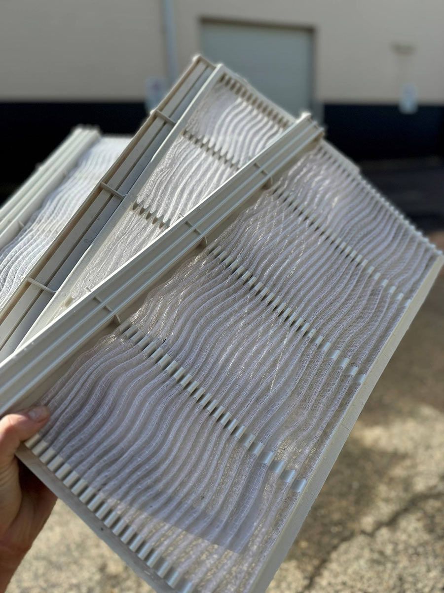 A Person Is Holding Three Pieces Of Filters In Their Hand — COOLIT NT In Humpty Doo, NT