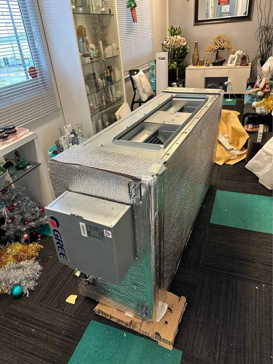 A Large Machine Is Sitting On Top Of A Cardboard Box In A Living Room — COOLIT NT In Berrimah, NT