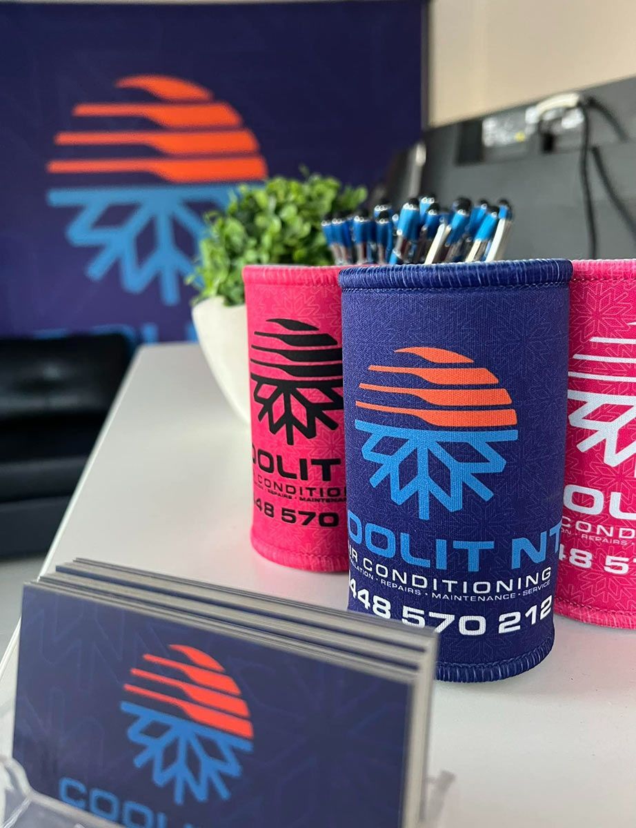 Three Can Holders With The Word CoolIT On Them — COOLIT NT In Berrimah, NT