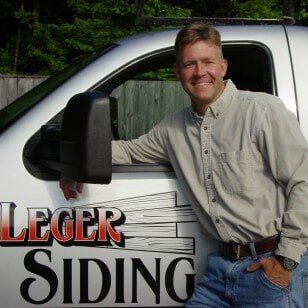 Man Replacing Window - Window Replacement in Leominster, MA Man Replacing Window - Window Replacement in Leominster, MA