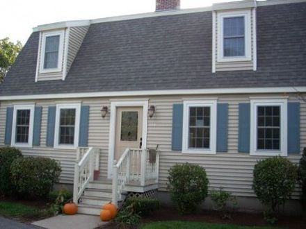 Beige House Siding - Customized Decks in Leominster, MA