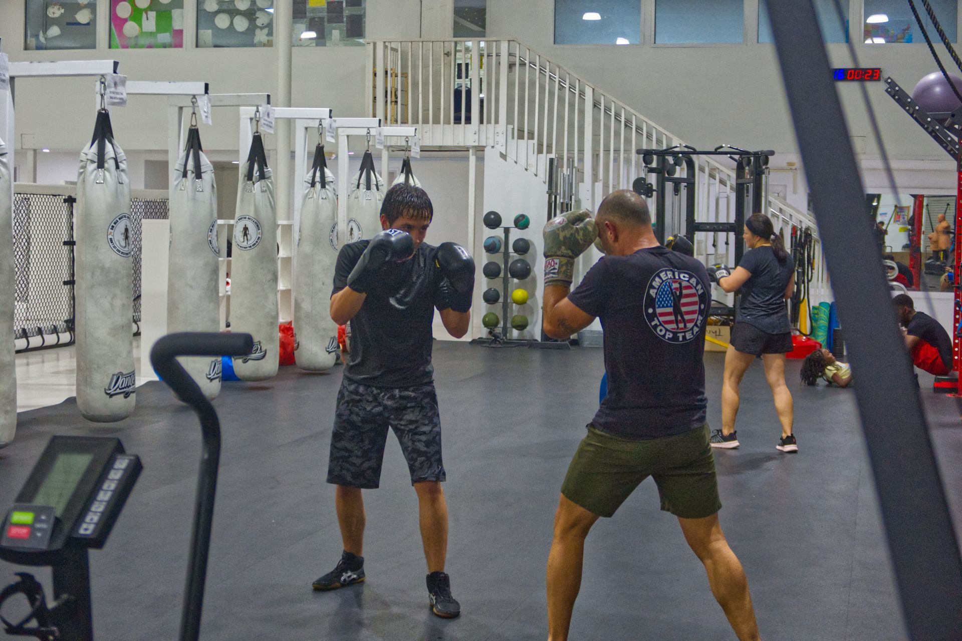 Adult Striking class at American Top Team Aventura/NMB, coach and student