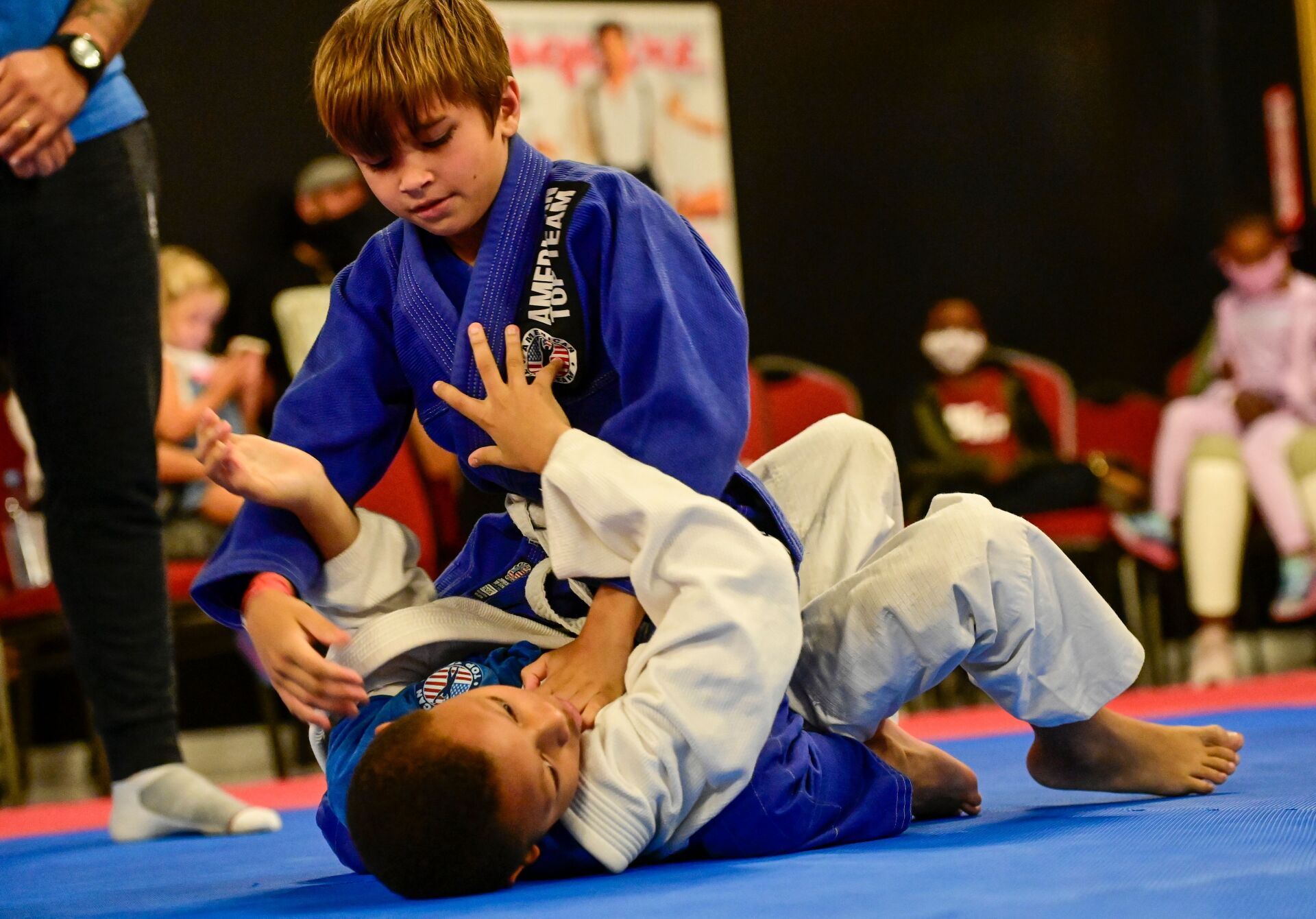 Two Children grappling during a Brazilian Jiu-Jitsu class at American Top Team Aventura/NMB