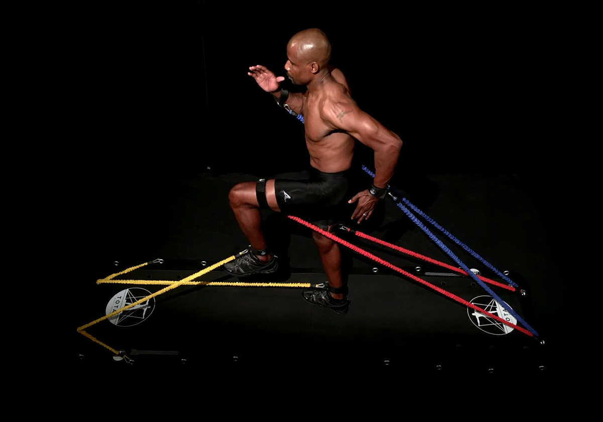 Charles Austin working out on the Total Body Board
