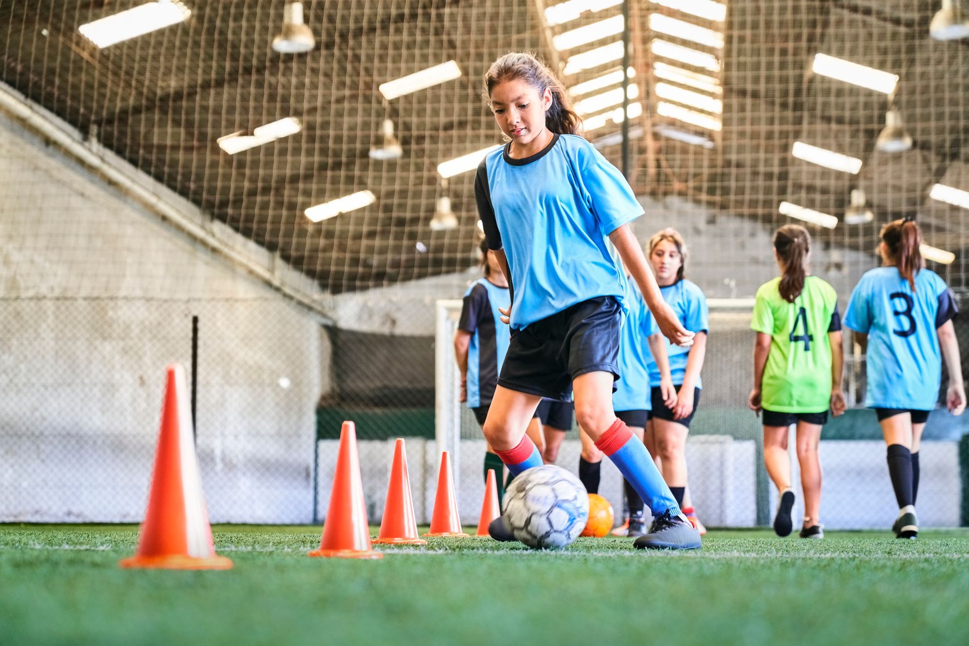 child playing soccer
