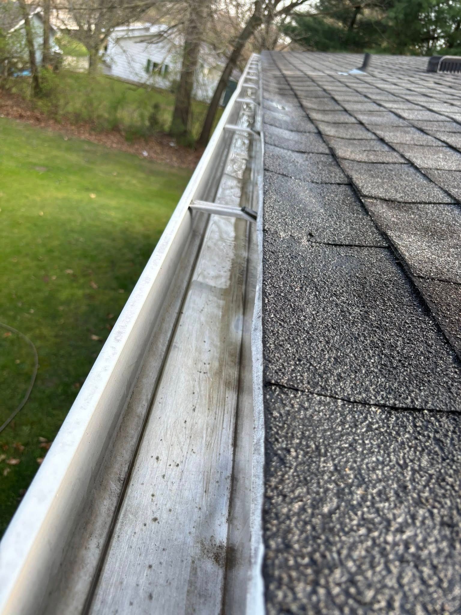 A close up of a gutter on top of a roof.