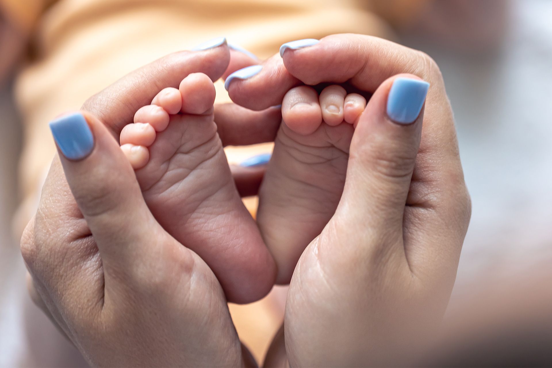Doctor examining newborn for injury