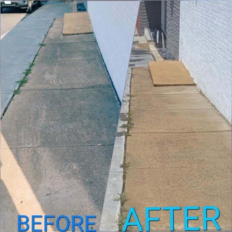 Sidewalk before/after power washing. Gray concrete before, tan concrete after, next to white building.
