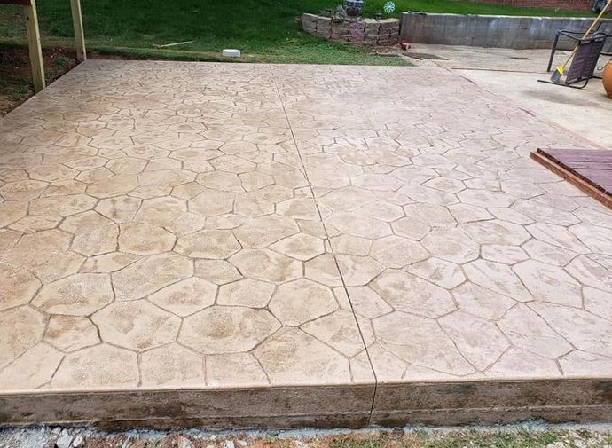 Stained and Stamped Concrete Patio with Flower Rock Pattern in Mockingbird heights