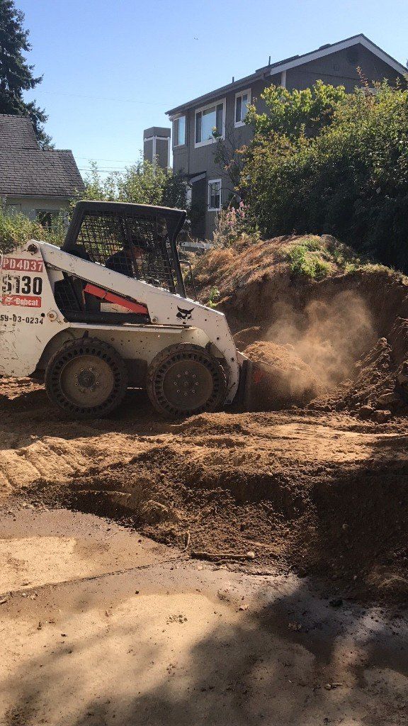 Landscape Excavation — Leveling Truck At Work In Everett, WA