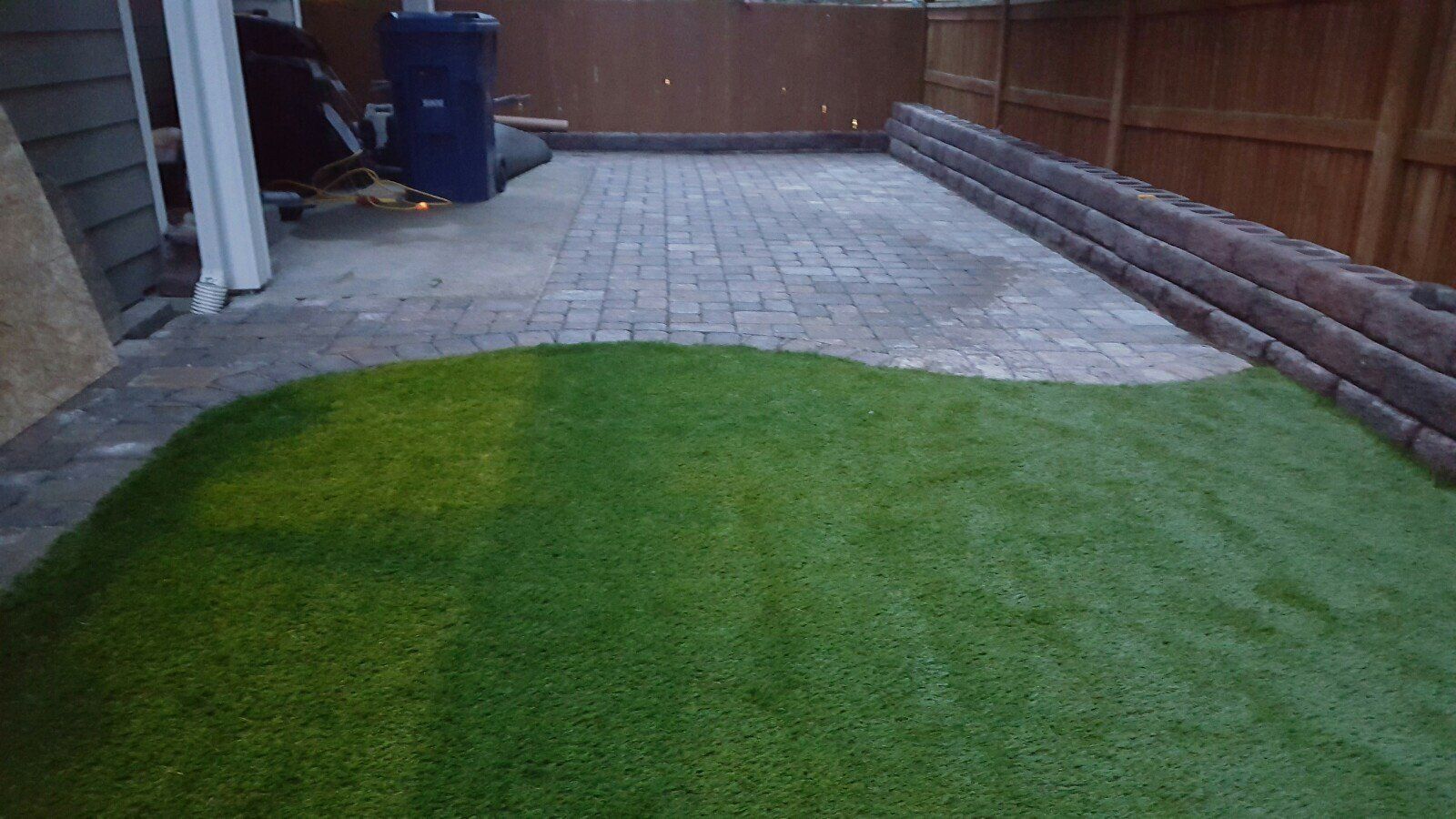 Landscaping — Brick Backyard With Retaining Wall After In Everett, WA