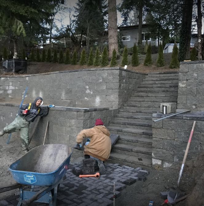 Retaining walls and stone steps — Brick Backyard With Retaining Wall During In Bellevue, WA